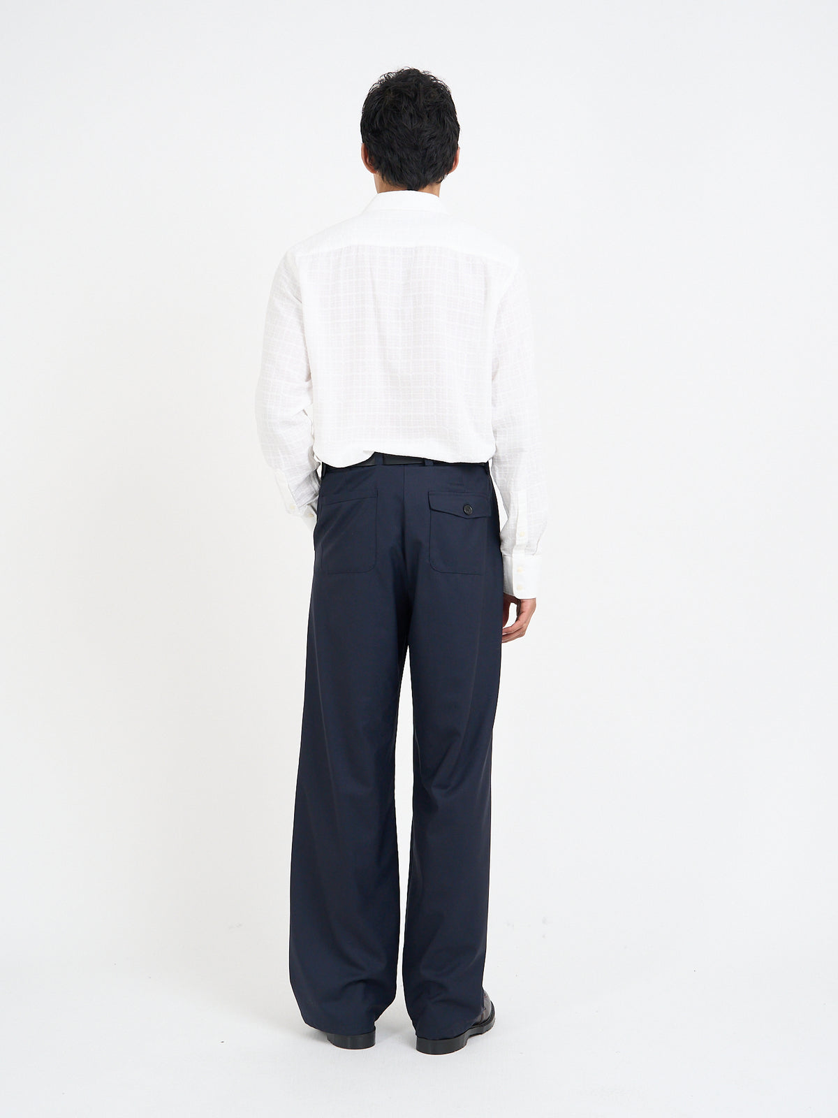 Rear view of Orsman trousers in navy tropical wool