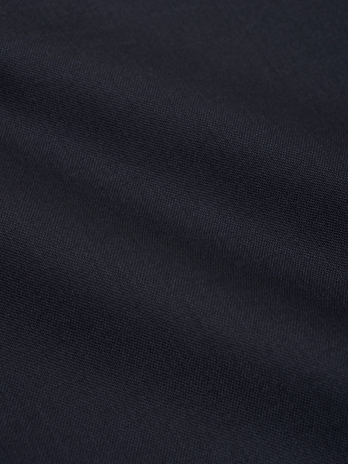 Close-up of navy tropical wool fabric used on Orsman trousers